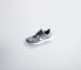 unpaired gray and white Nike Flyknit shoe